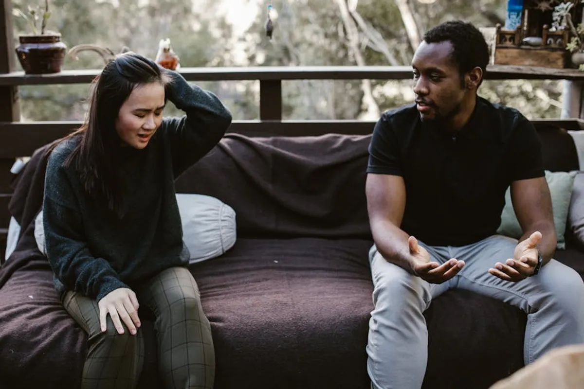 Couple talking calmly on a sofa