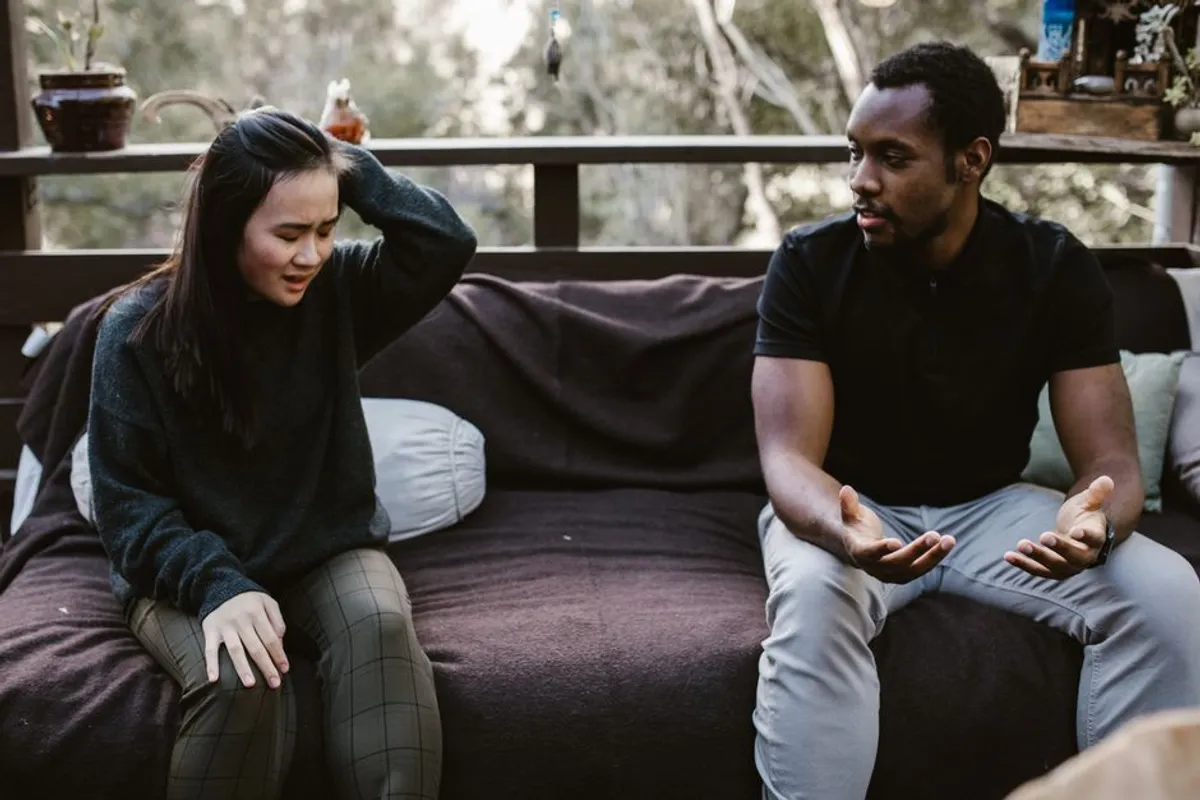 Couple talking calmly on a sofa