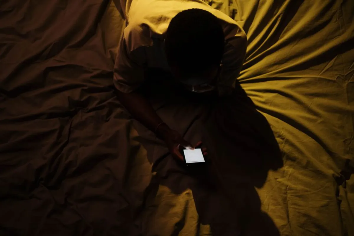 Person answering privately on a phone in a calm setting