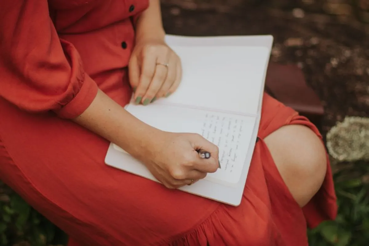 Couple writing notes together thoughtfully