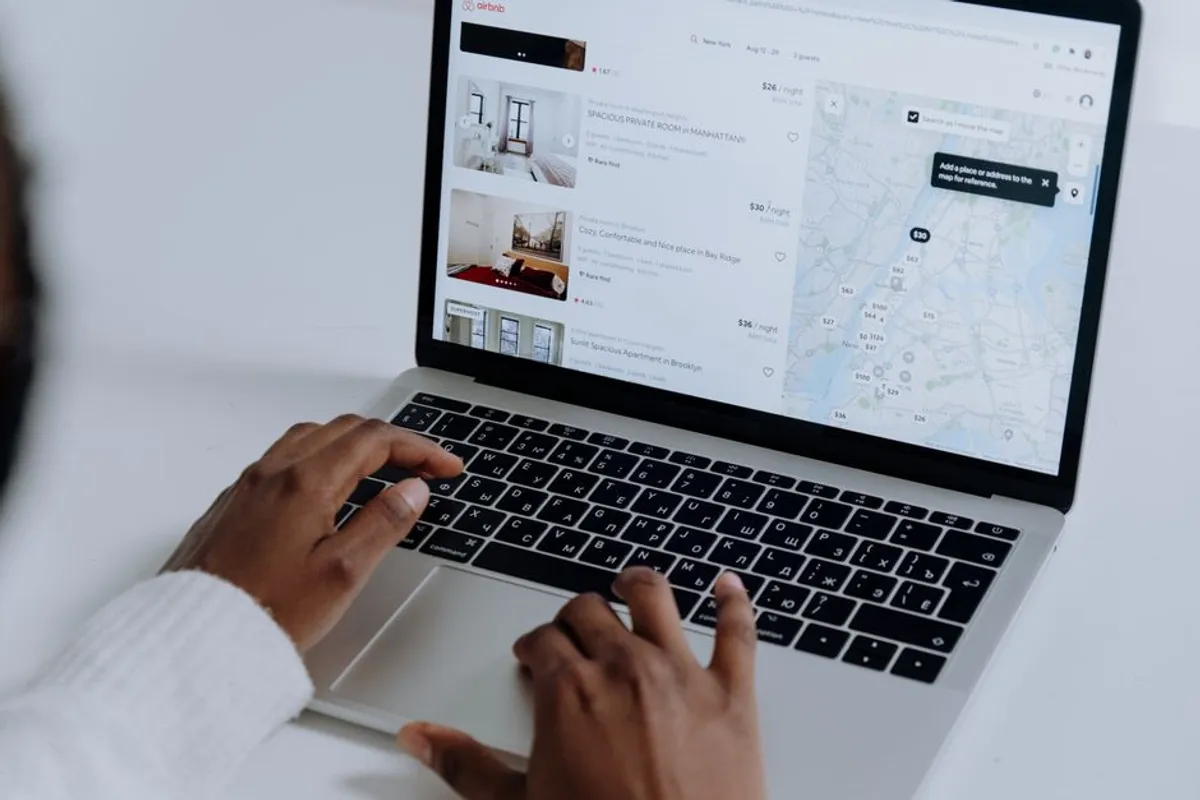 Person searching online for a therapist on a laptop