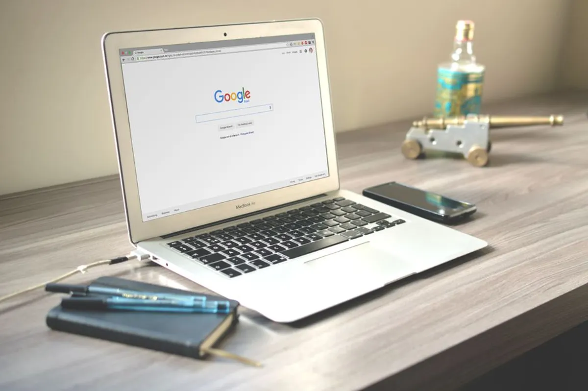 Person searching for a therapist on a laptop