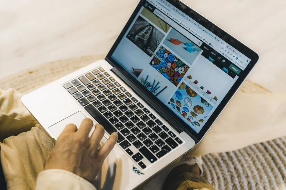 Person searching for a therapist on a laptop