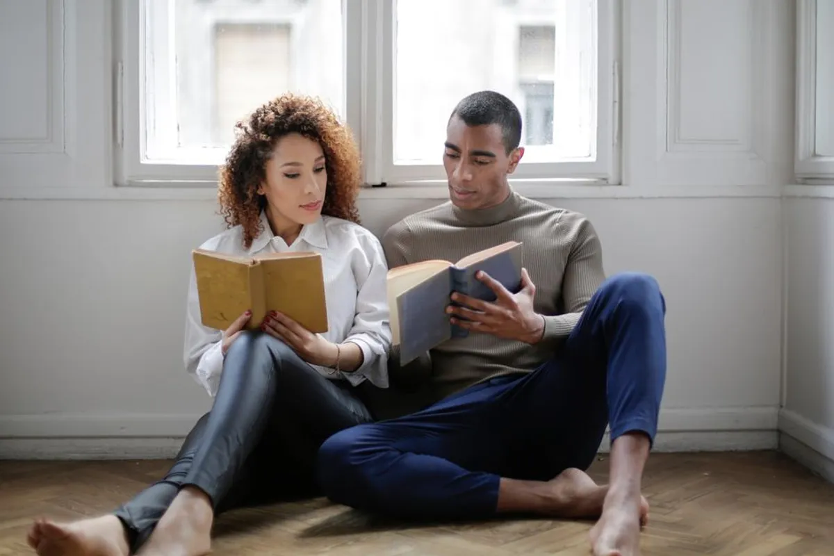 Couple reading together at home