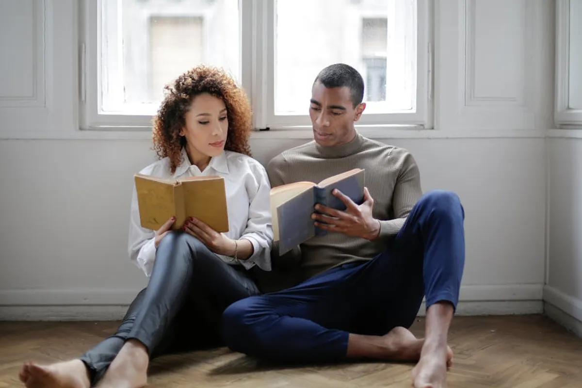 Couple reading together at home