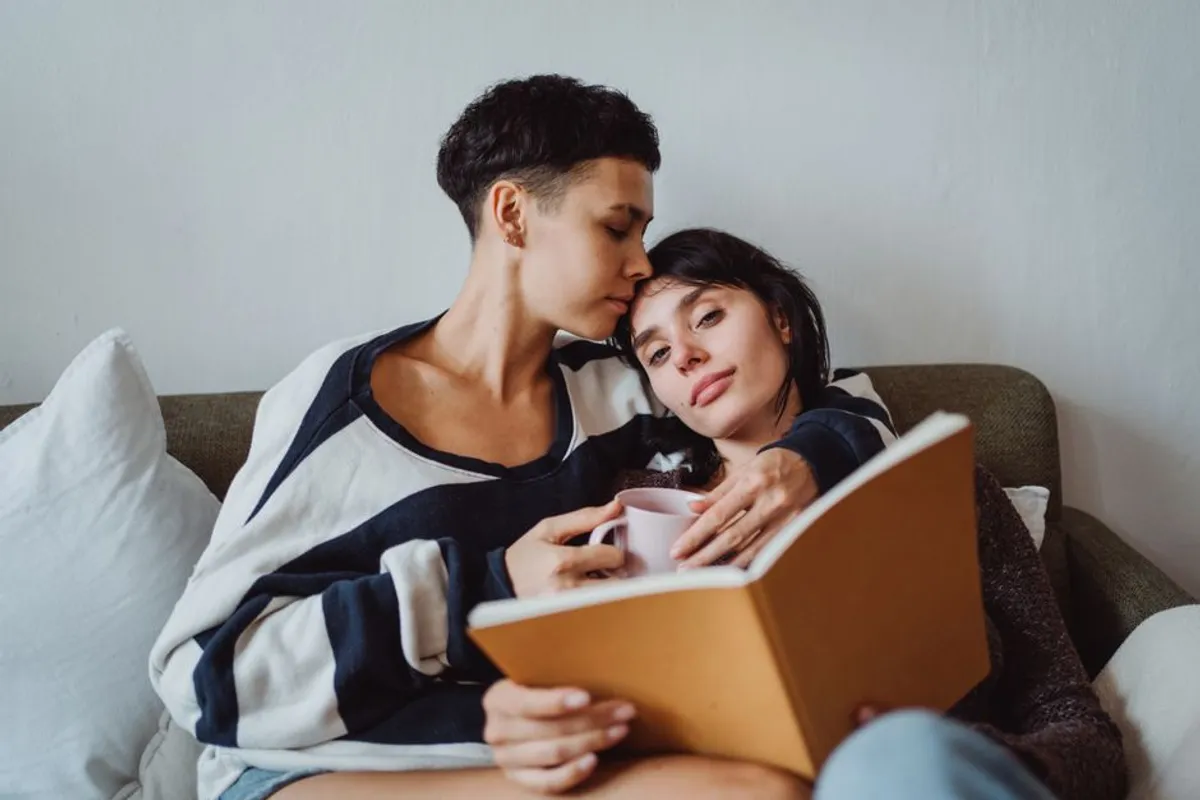Couple reading together at home in a relaxed setting
