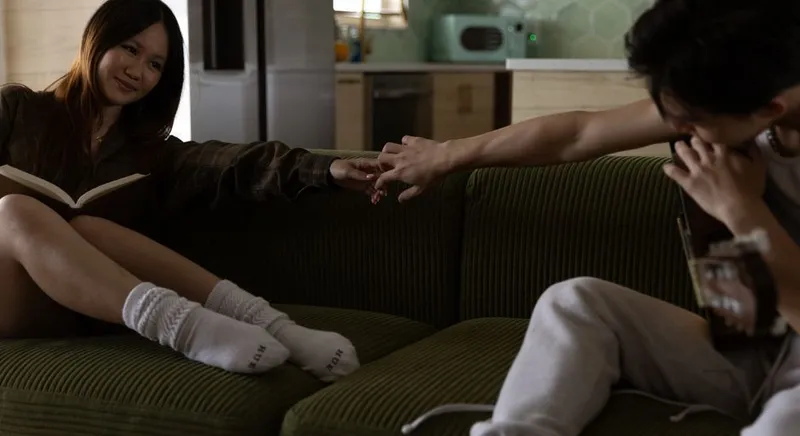 Couple close together at home in warm evening light