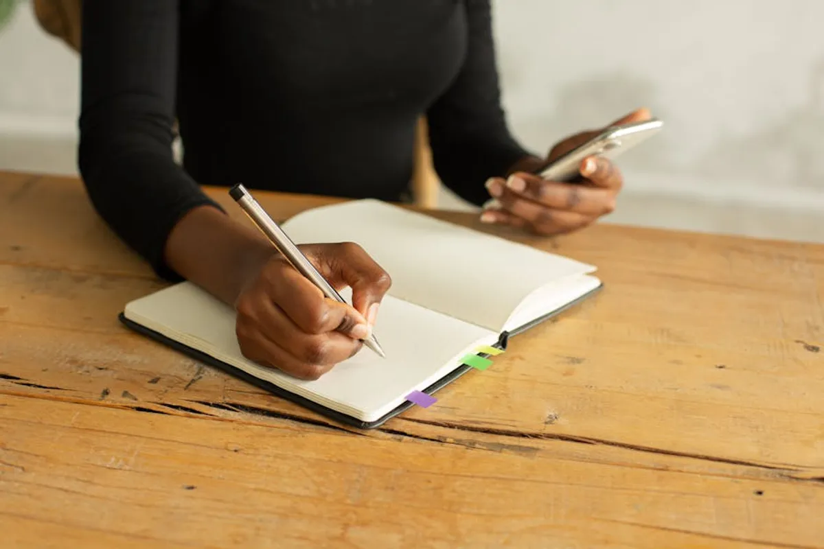 Couple with notebooks and phones at a table
