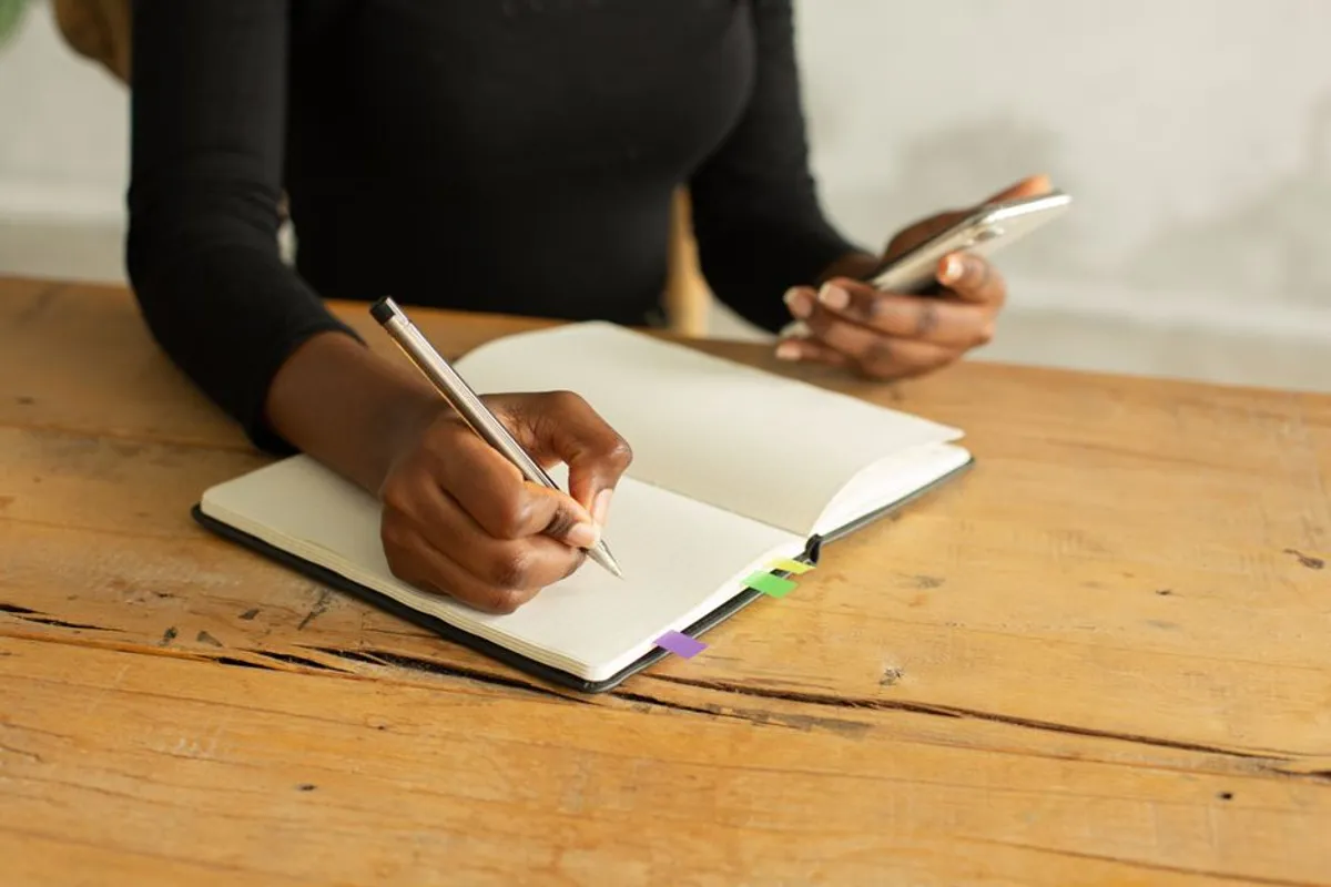 Couple with notebooks and phones at a table