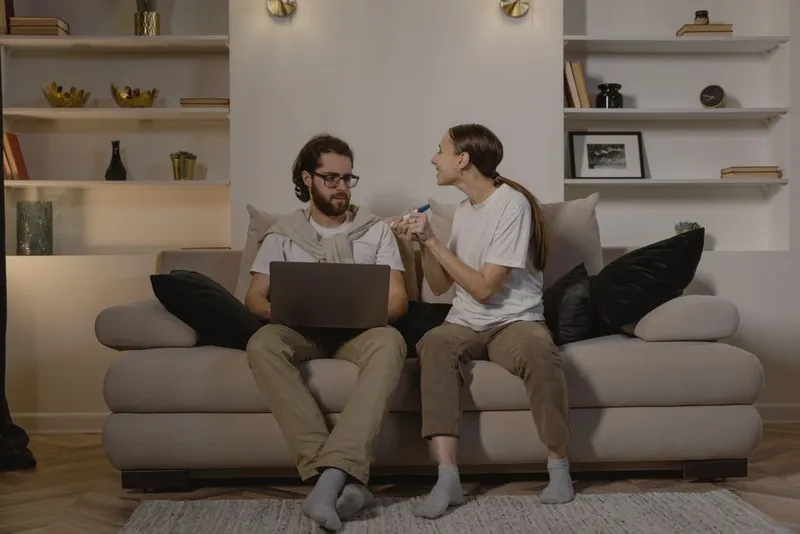 Couple sharing a happy discovery at home