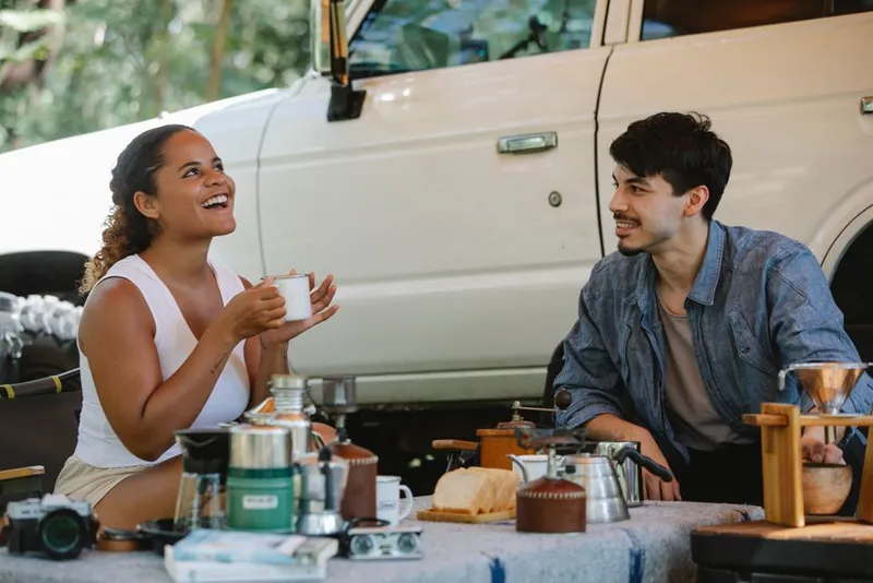 Couple smiling outdoors together on an adventure