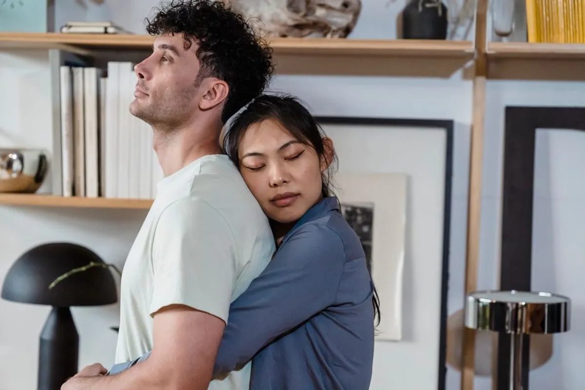 Couple embracing warmly indoors