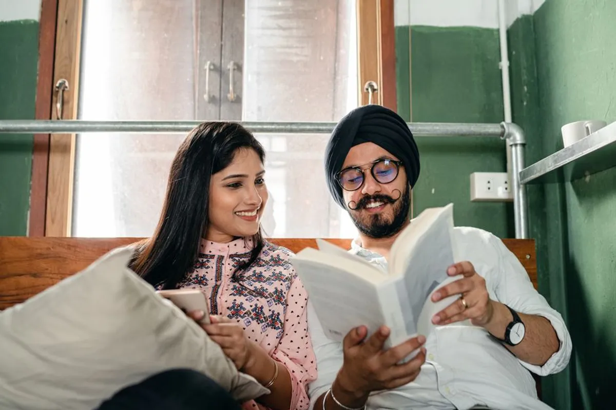 Couple relaxed and reading at home