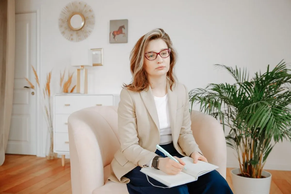 Therapist with a notebook in a professional office