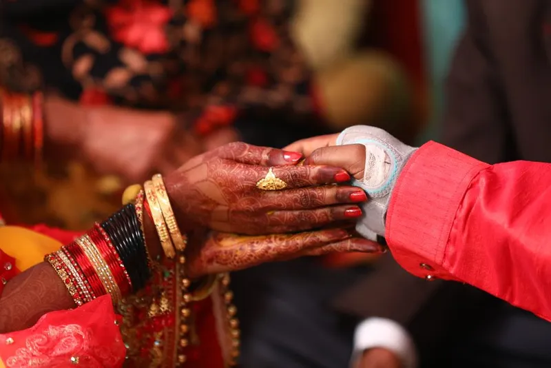 Couple holding hands warmly together