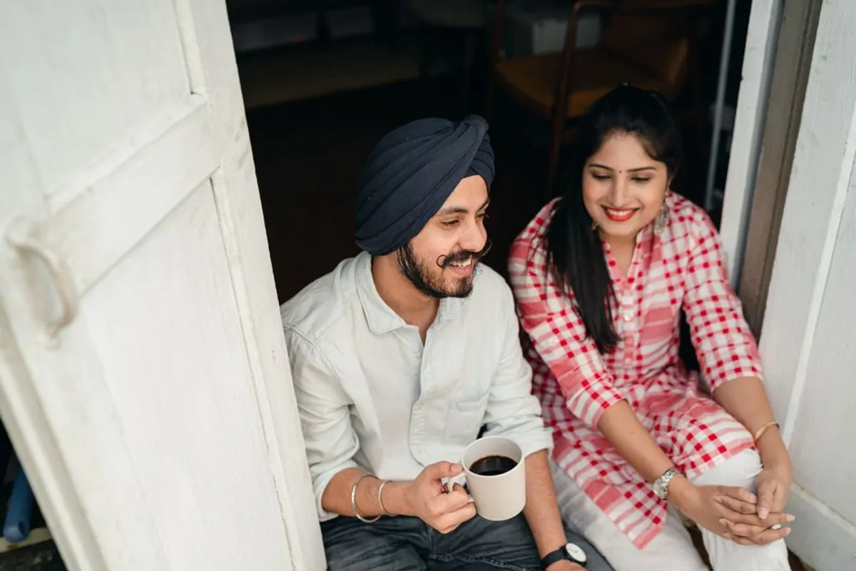 Couple laughing and relaxed together at home