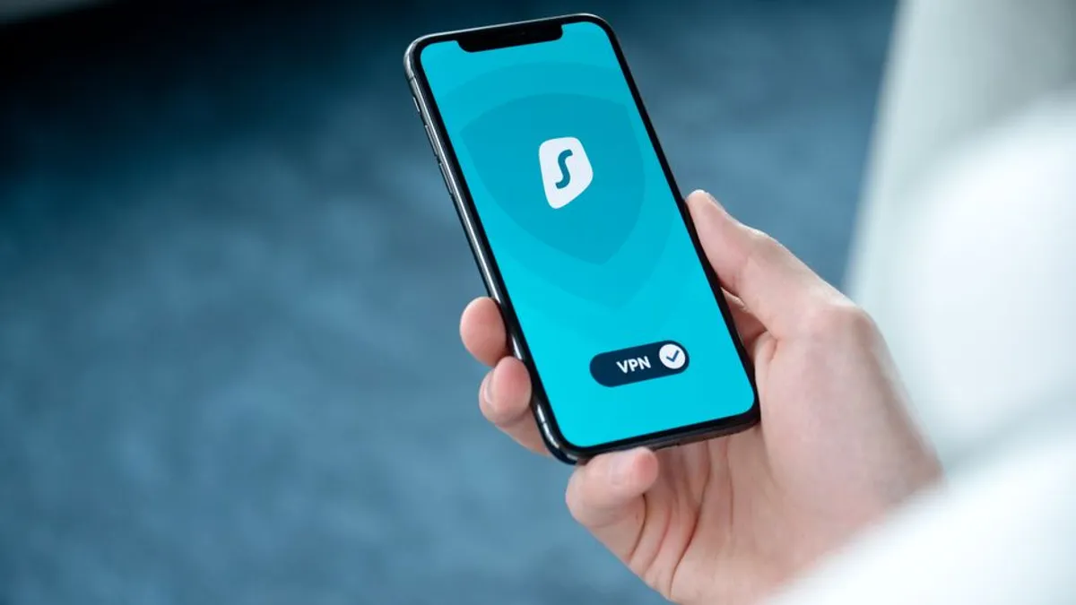 Hands holding a phone with a private screen