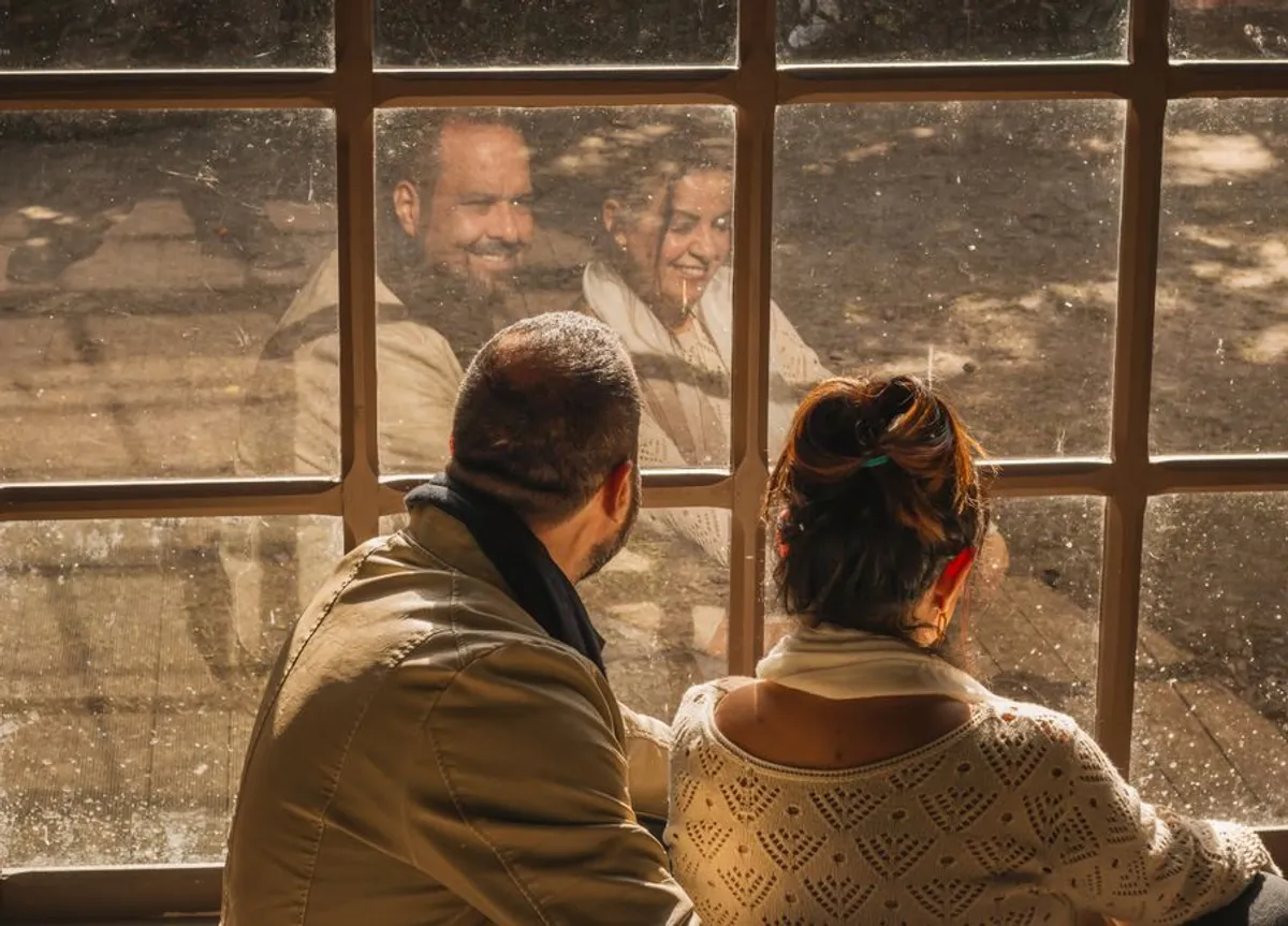 Couple sitting quietly together, thoughtful and calm