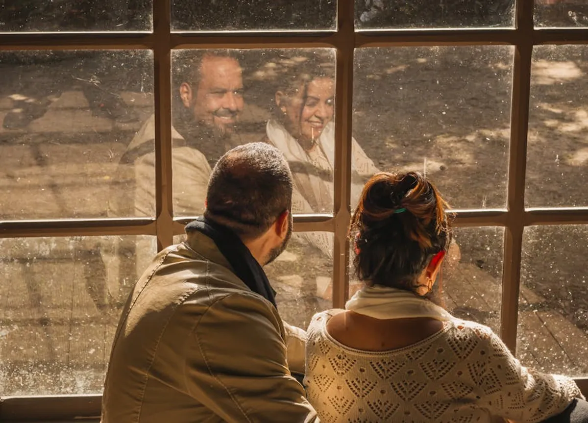 Couple sitting quietly together, thoughtful and calm