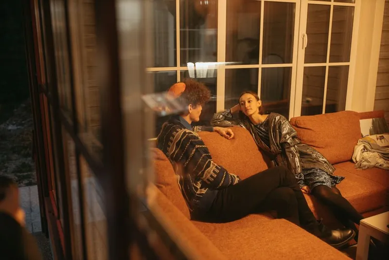 Couple having a warm conversation on a sofa